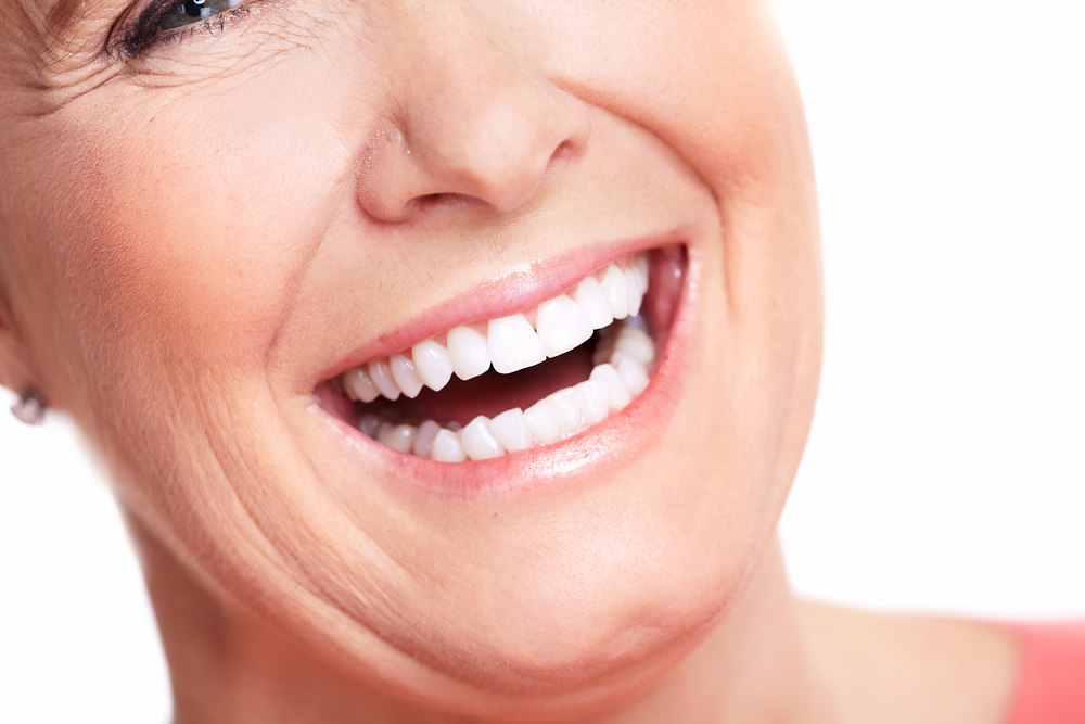 Woman with healthy teeth smiling