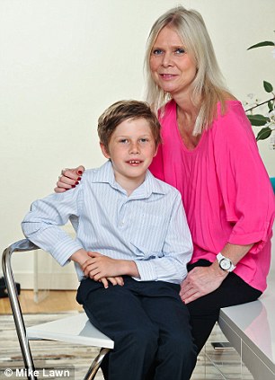 Smiling again: Michelle Longhurst with her son Ben, who broke his front teeth while out roller-blading