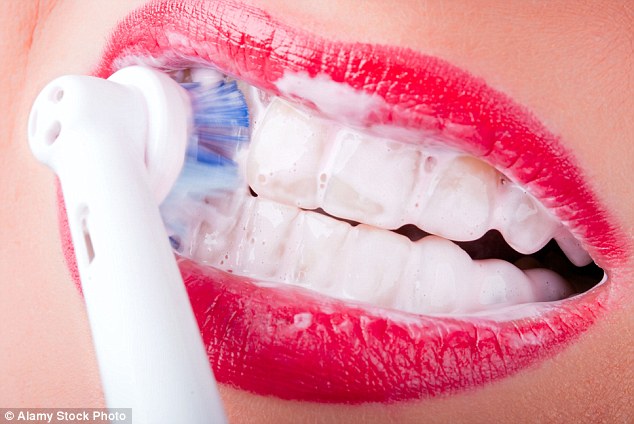 Electric toothbrushes wear away the protective layer of her tooth enamel, and expose the sensitive root, with inevitable, painful consequences. Dentists say that people are brushing too hard and fast with them and it’s causing damage. They advise returning to old-fashioned, manual brushing (stock image)