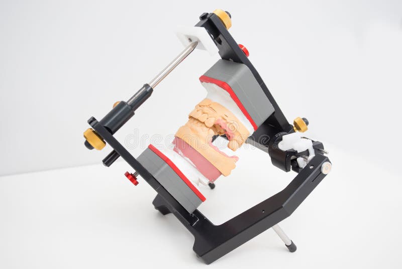 Articulator with jaw model in the dental laboratory stock image