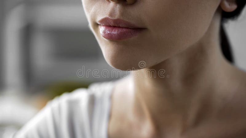 Beautiful asian woman face closeup, natural skin care products, lip balm, herpes royalty free stock photography
