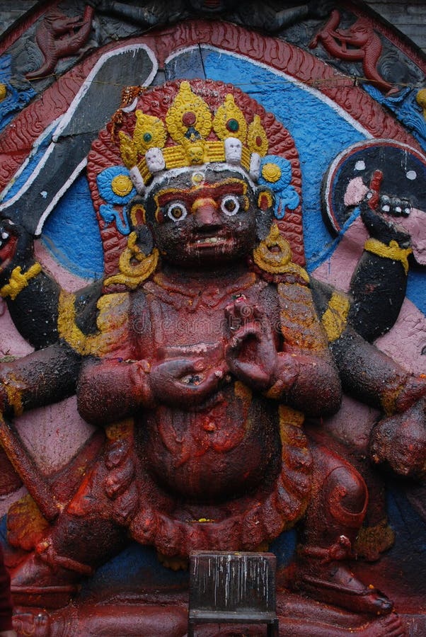 The big black god statue Nepal. The big black god is a single head with six arms, with open eyes in the forehead, high cyanosis, and a two-layered skull on the stock photography