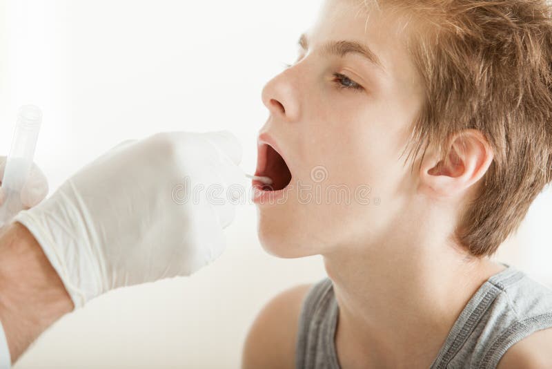 Boy opening mouth on medical checkup royalty free stock image