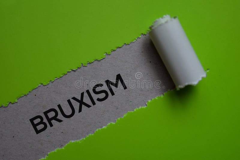 Bruxism Text written in torn paper. Medical concept stock photo