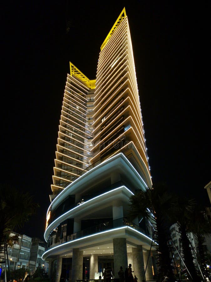 China modern unusual architecture wedge shaped sharp POI Ted building, night illuminated royalty free stock photos