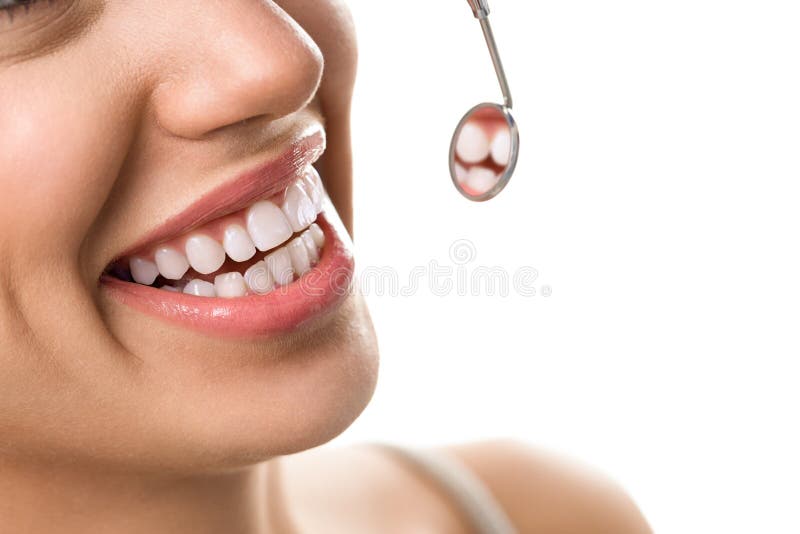 Close-up of smile patient with healthy tooth with dental mirror stock photography