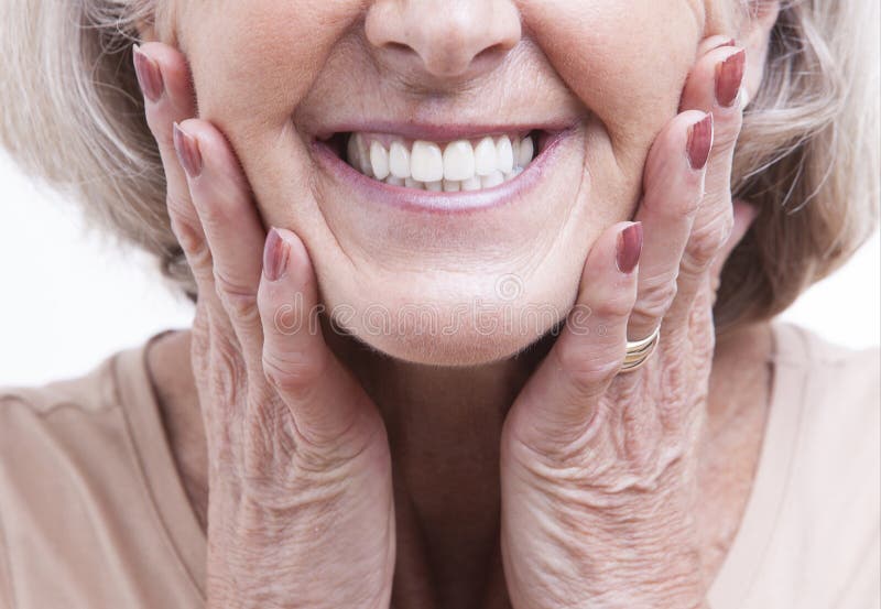Close up view on senior dentures stock image