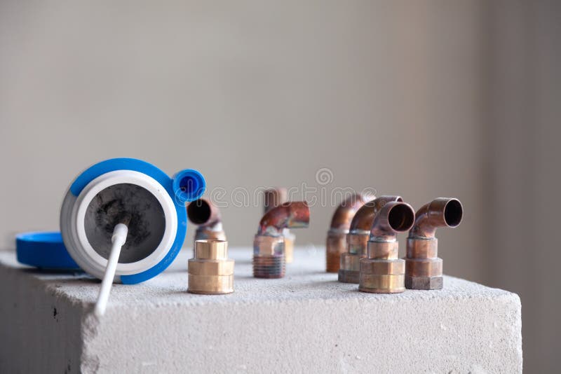 Closeup copper pipes, fittings, aluminum flux paste for solder for brazing with gas burner. Concept installation, repair, change. Of pipeline of apartment house royalty free stock photos