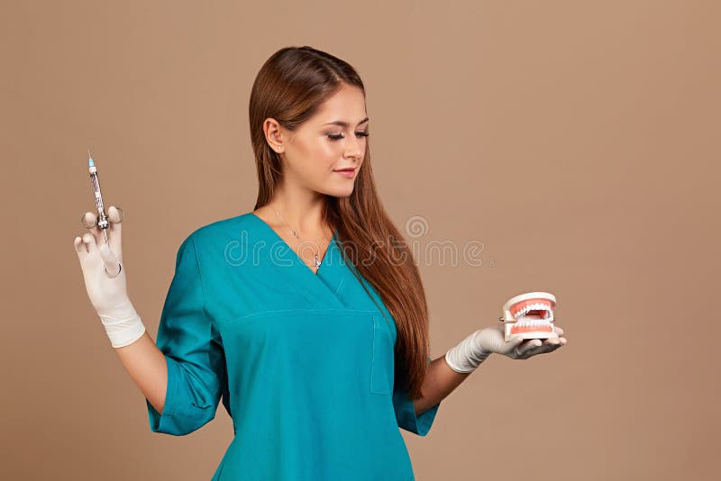 Dental anesthesia or puncture cyst tooth concept photo. Doctor dentist holding syringe, pursuing dental anesthesia. Procedure, cyst puncture royalty free stock photo