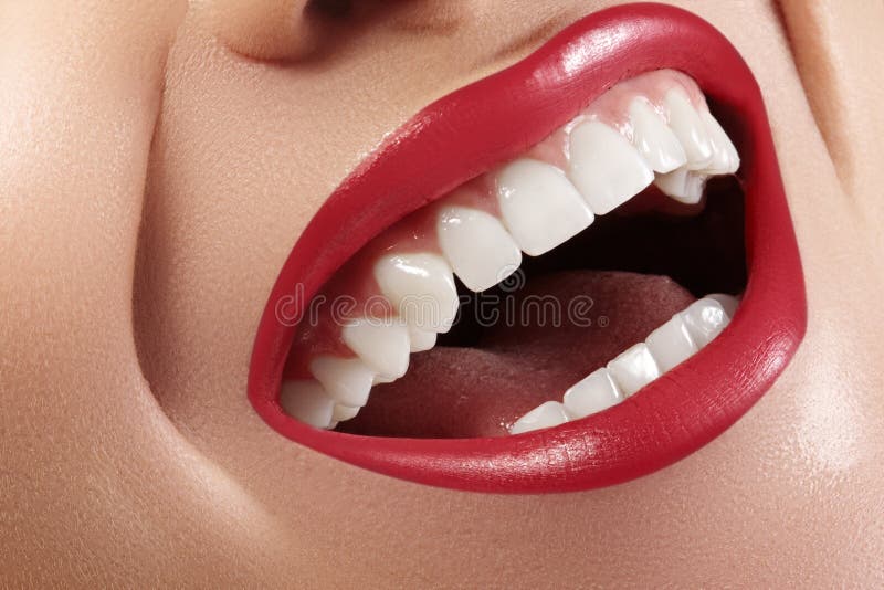 Dental Beauty. Beautiful Macro with perfect White Teeth. Fashion Lips Red Make-up. Whitening Tooth, Wellness Treatment royalty free stock photography