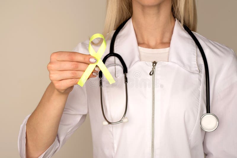 Female doctor in white uniform with light green ribbon awareness in hand for Celiac Disease, Chronic pelvic Pain, Human Papilloma. Virus, Sexually Transmitted royalty free stock photography