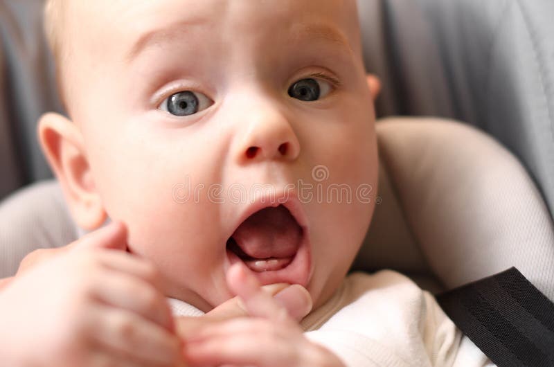 The first babies teeth. The lower front teeth the lower central. Incisors. Teething stock photo