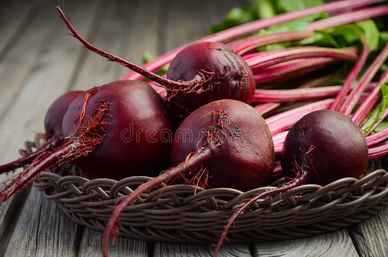 Fresh beets on wooden background stock photography