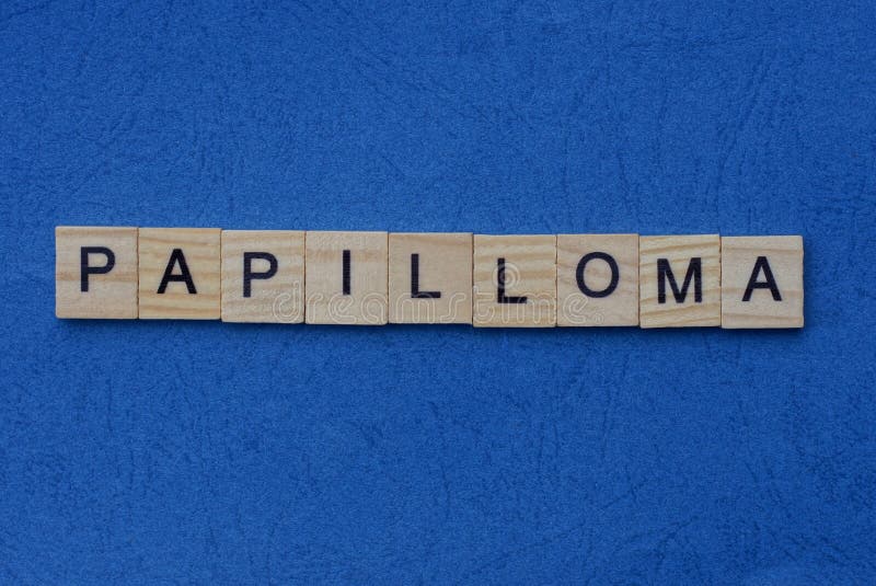 Gray word papilloma from small wooden letters. On a blue table royalty free stock photography