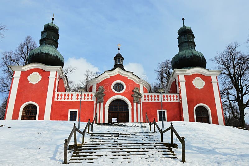 Lower baroque church on calvary in Banska Stiavnica with snow covered staircase. Photograph taken during partly cloudy winter day stock images