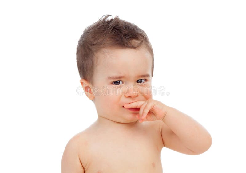 Nice baby with sore gums. Isolated on a white background stock photography