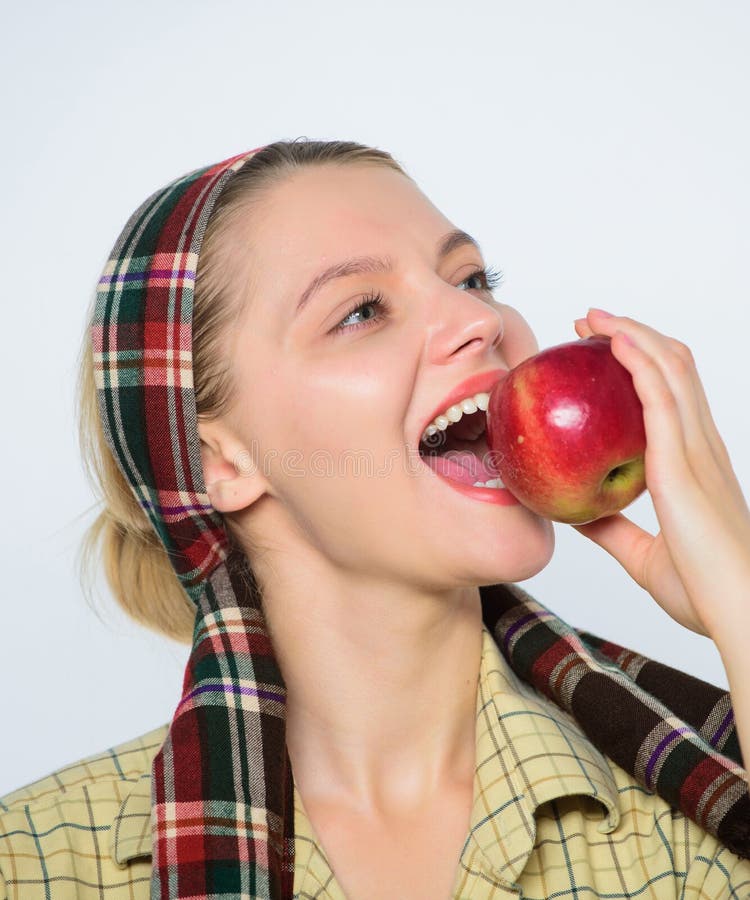 The nutritional choice. temptation. spring harvest. summer fruit. farming concept. healthy teeth. orchard, gardener girl. With apple basket. vitamin and dieting royalty free stock image