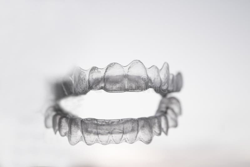 Orthodontics to correct alignment of teeth. Invisible orthodontics for aligning teeth royalty free stock photography