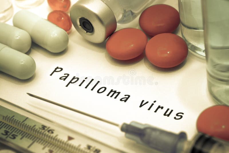 Papilloma virus. Diagnosis written on a white piece of paper. Syringe and vaccine with drugs royalty free stock photos