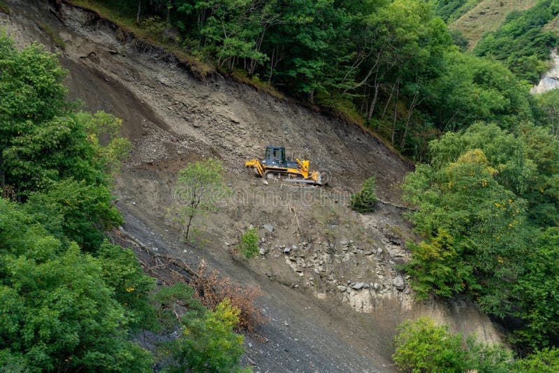 Repair of dirt road in the mountains of Upper Khevsureti, Georgia stock photography