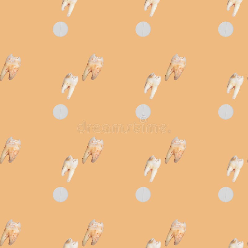 Seamless pattern with torn teeth and tablet on a beige background royalty free stock photo
