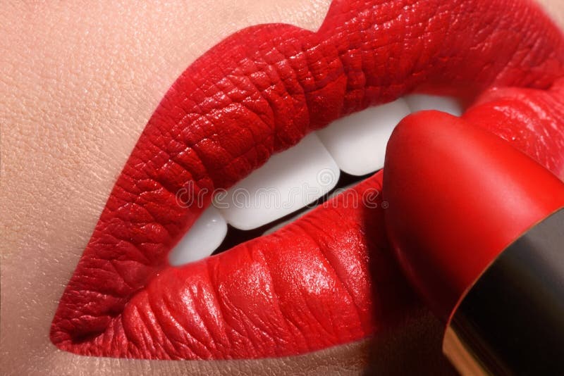 Sensual open mouth with red tube of lipstick royalty free stock photography