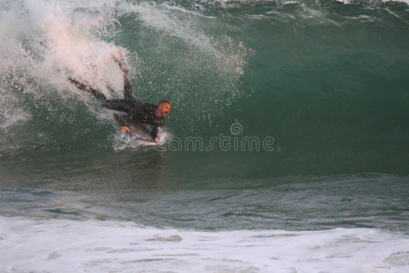 Surfing The Wedge stock photos