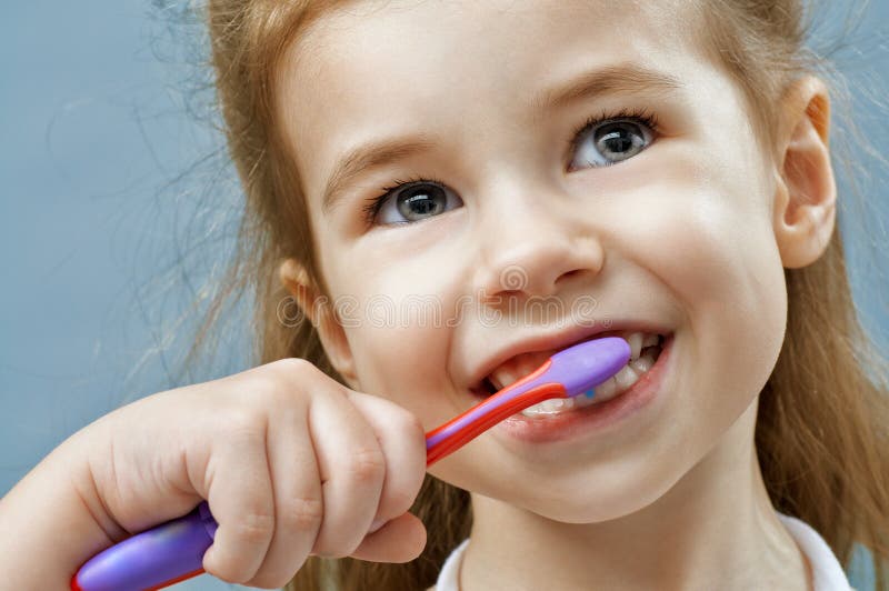 Teeth brushing stock photo