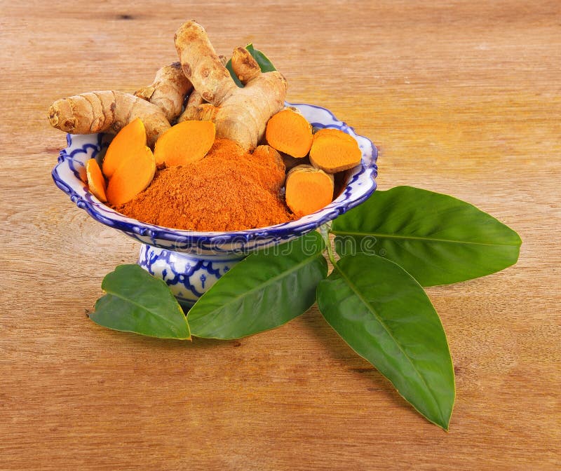 Turmeric powder and leaves royalty free stock images
