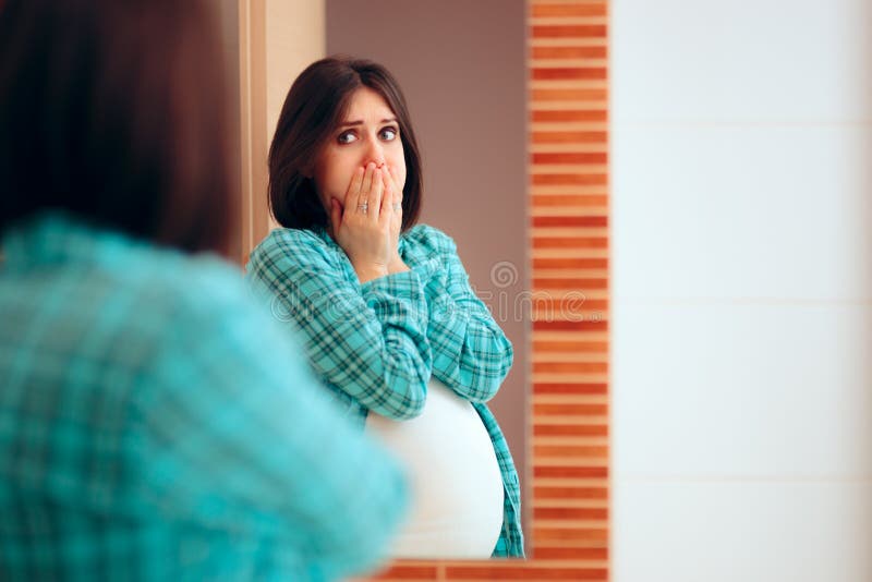 Pregnant Woman with Tooth Ache and Sore Gums. Woman experiencing pregnancy difficulties in her last trimester stock image