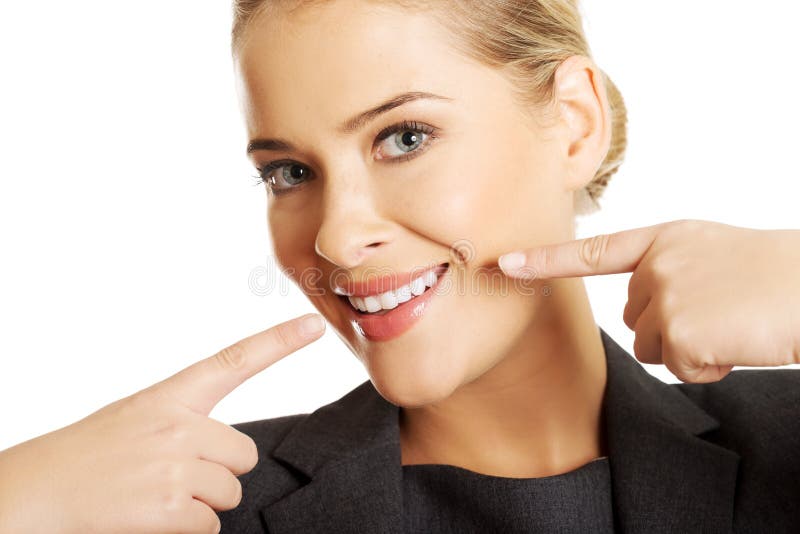 Woman showing her perfect white teeth stock photography
