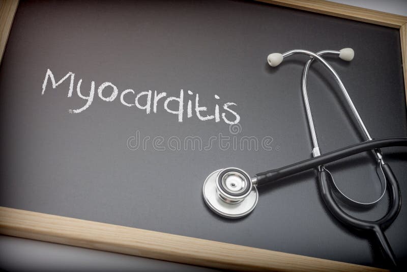 Word Myocarditis written in chalk on a blackboard black next to a stethoscope royalty free stock photo