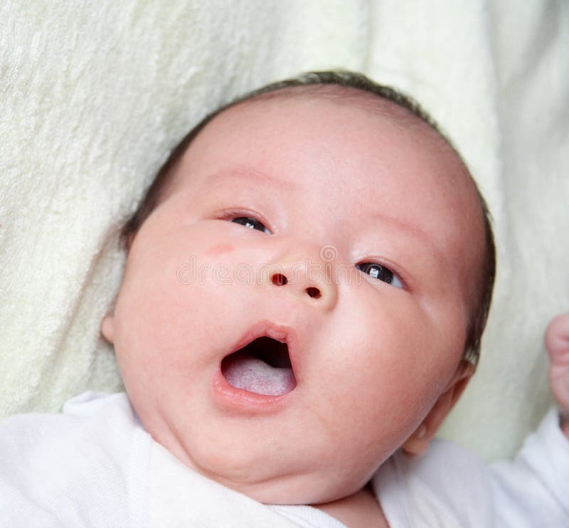 Yawning baby stock photography
