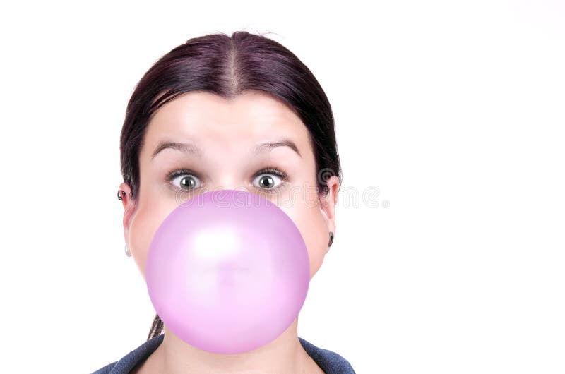 Young girl with a pink bubble of chewing gum. On white background royalty free stock images