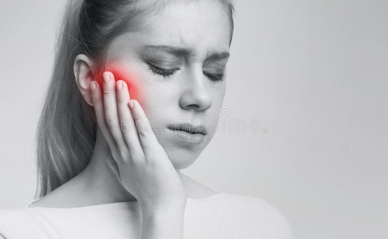 Young woman suffering from tooth pain, caries stock photos