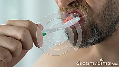 Dentist patient has bleeding gum while brushing teeth, hypersensitivity close-up. Stock footage stock video